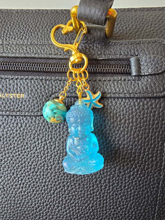 Bijou de sac / porte-clés howlite turquoise, bouddha
